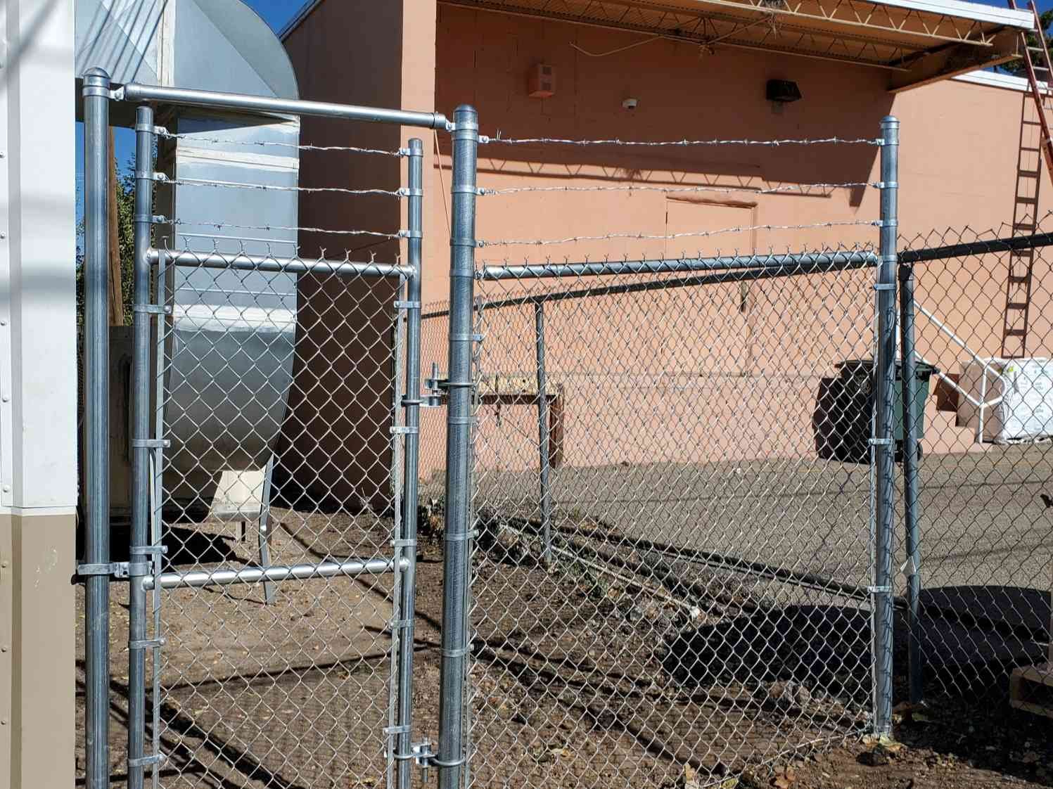 Chain link fence surrounding a house