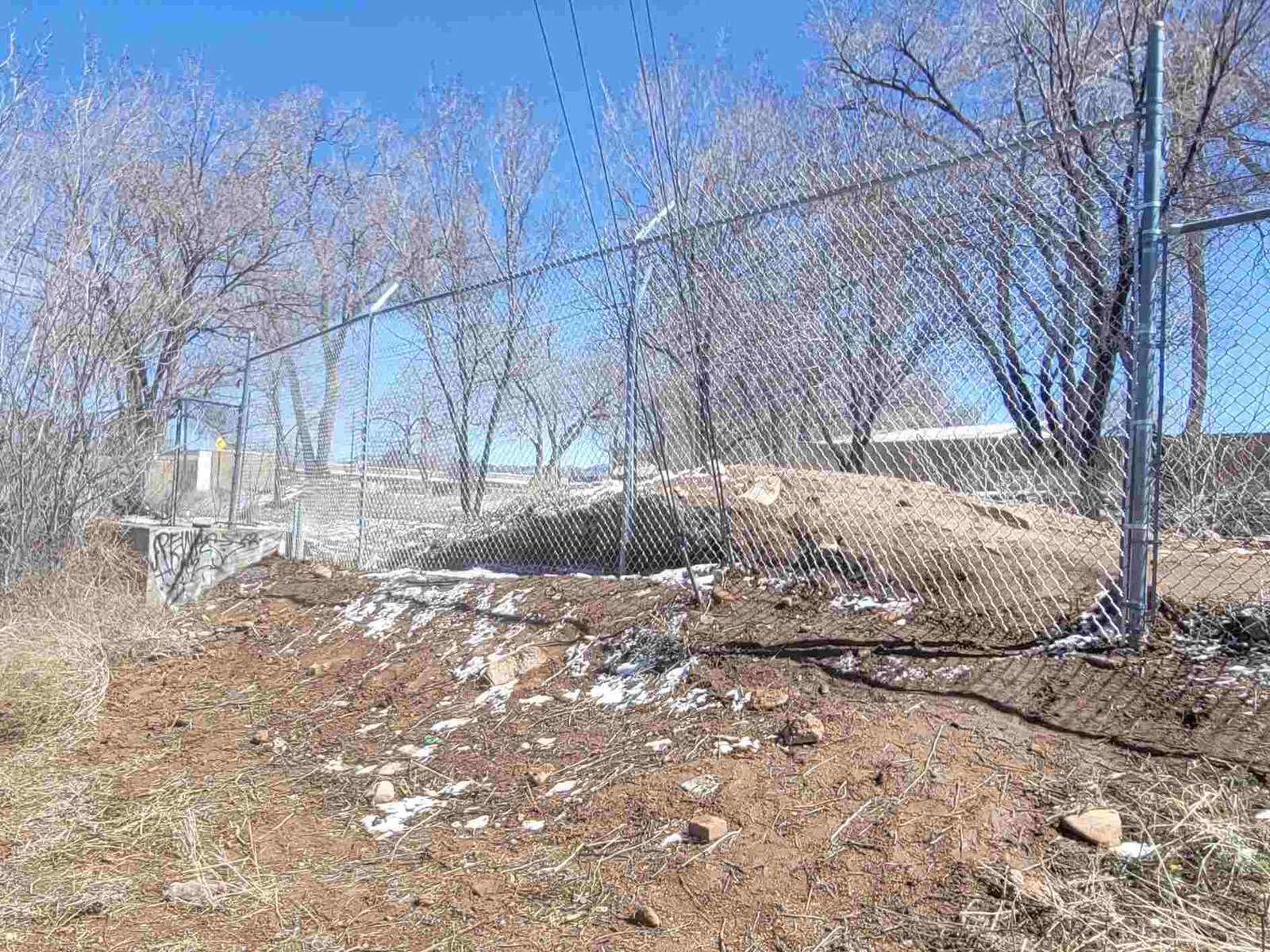 Chain link fence surrounding a yard during construction