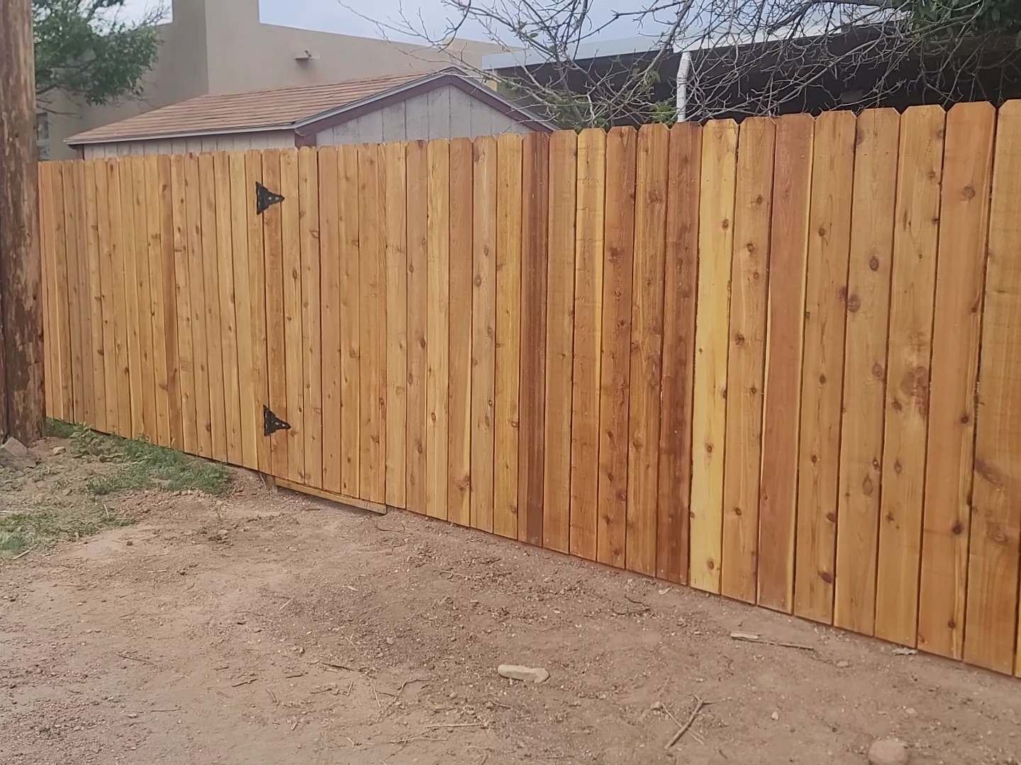 New wooden fence surrounding a residential property