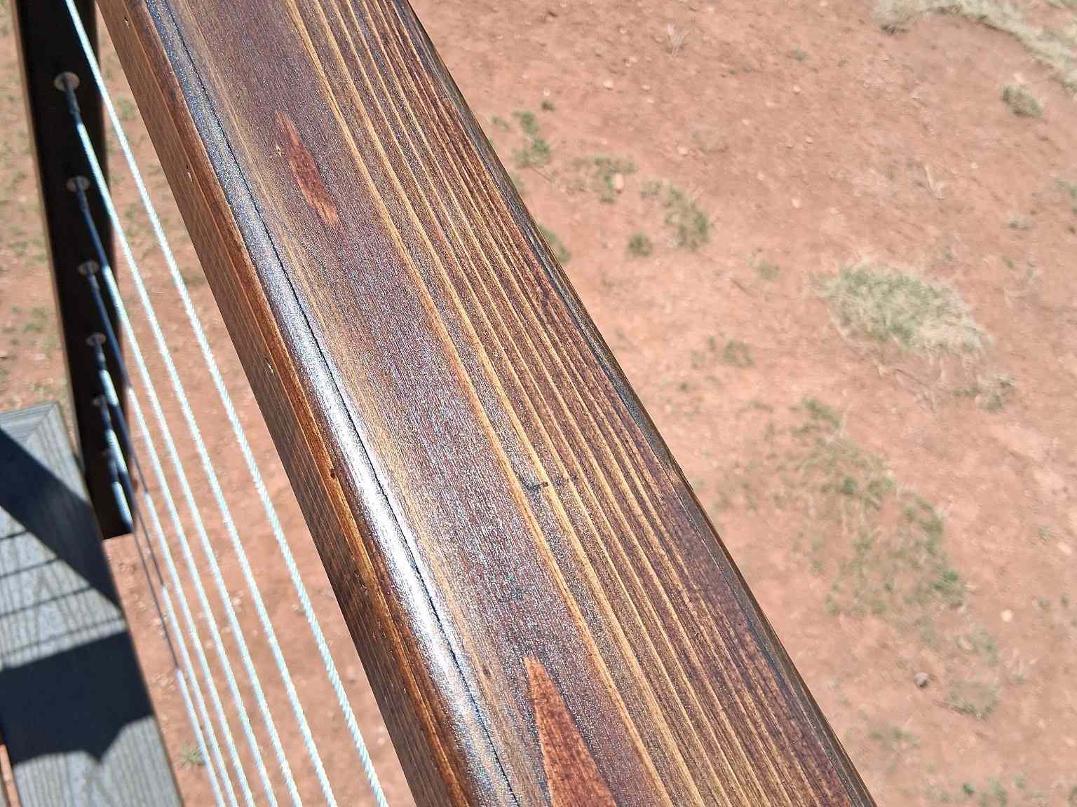 Wooden railing with cable handrail detail