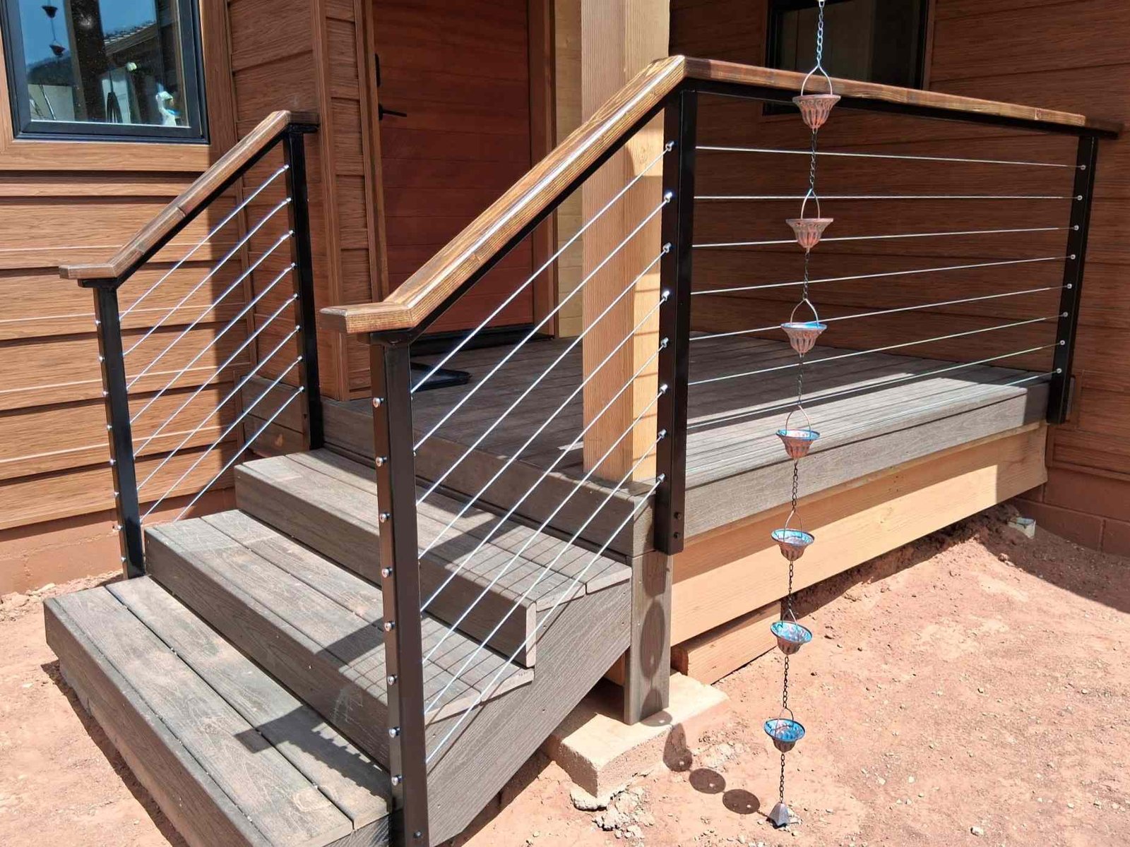 Wooden staircase with railing built outside a home