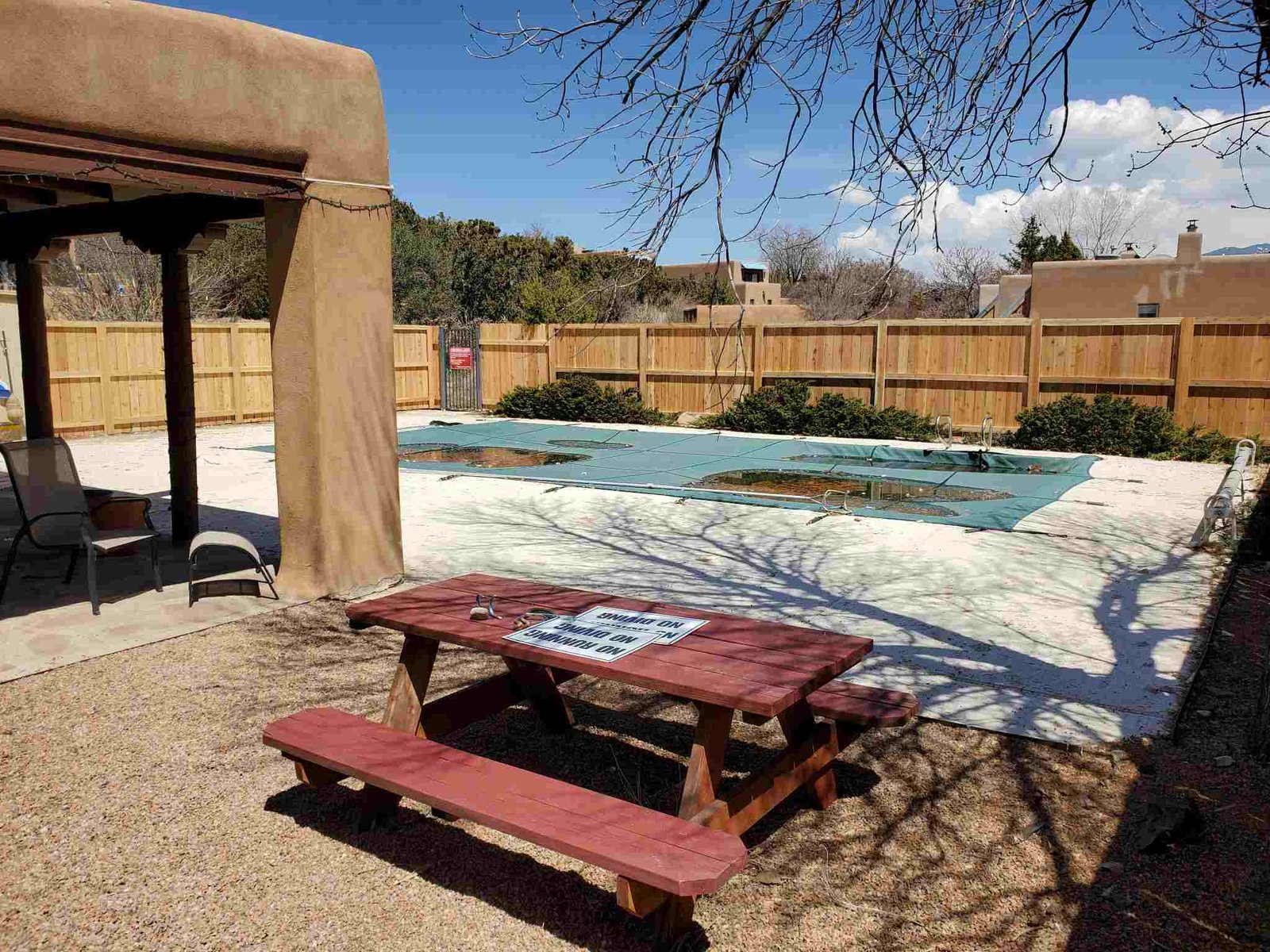 Backyard featuring a pool and picnic table